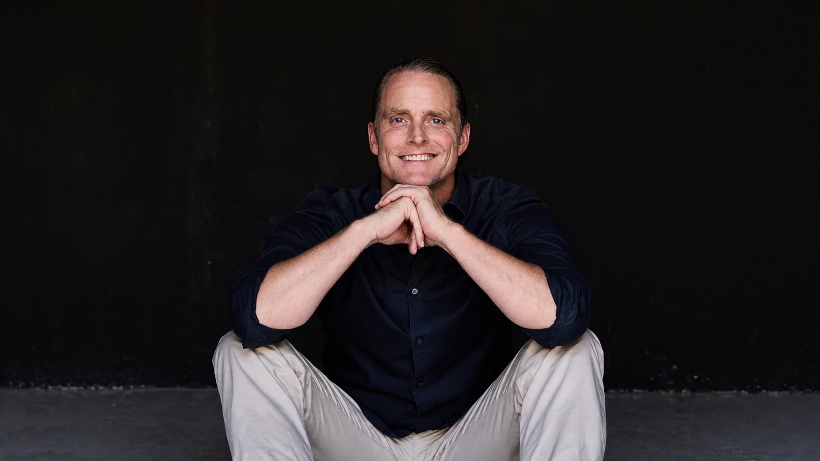 Jason Milne, seated portrait