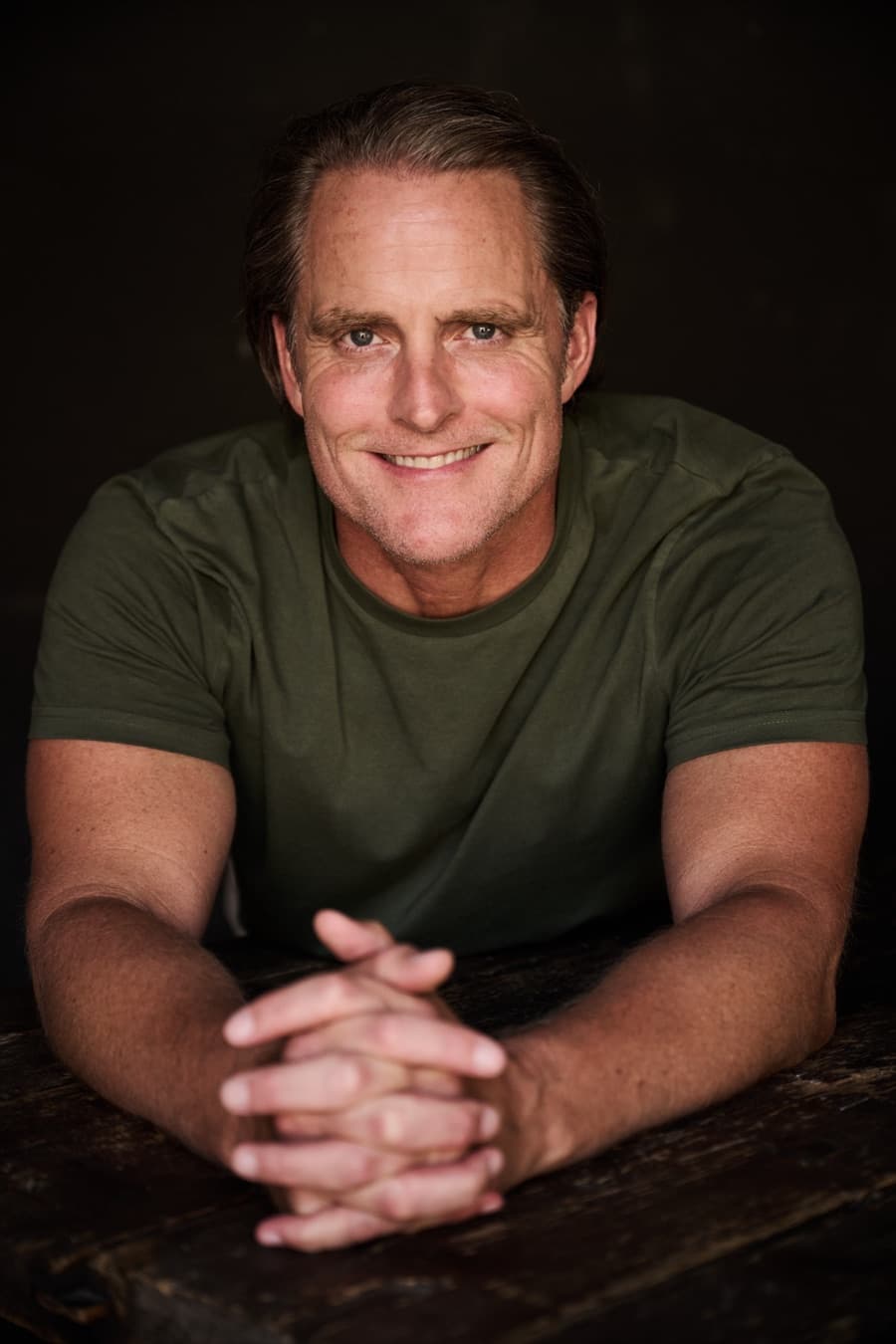Jason Milne, executive men's coach, arms crossed