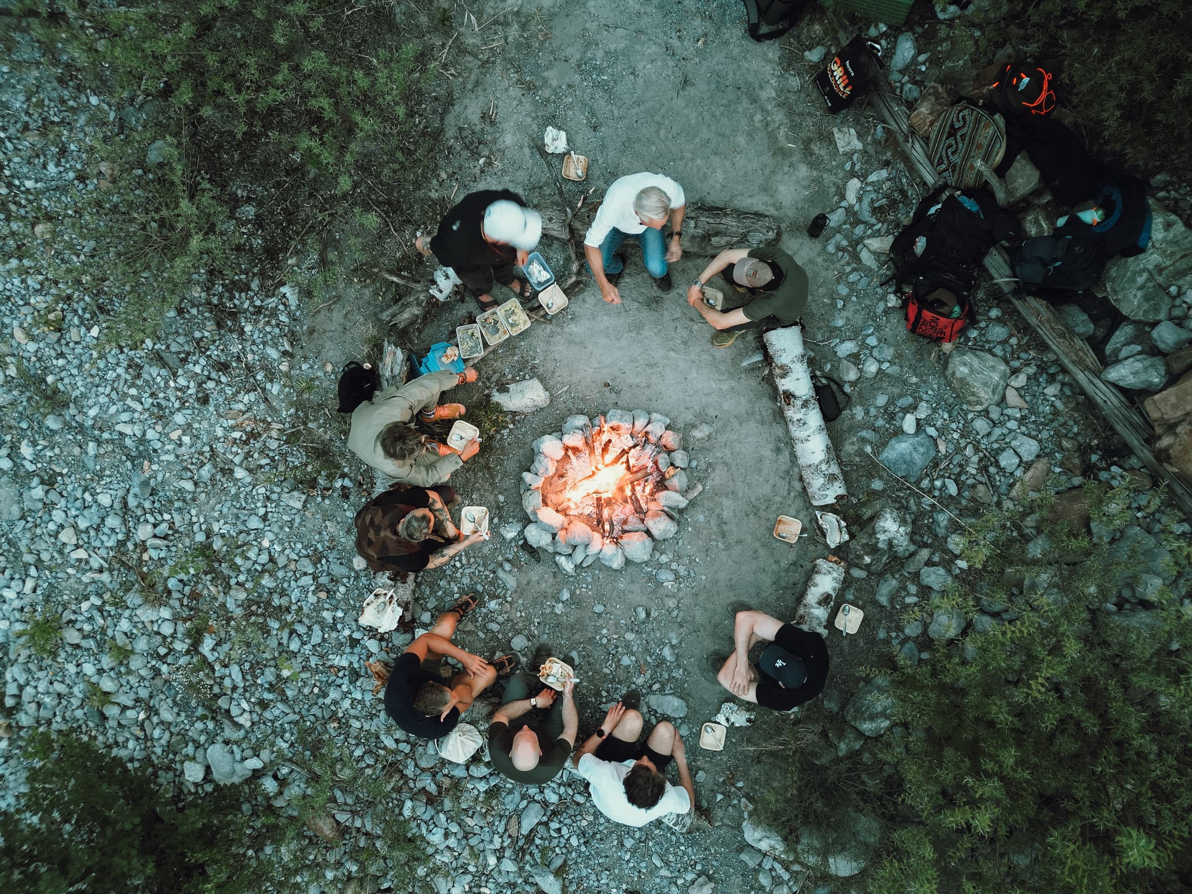 Aerial view of a men's retreat firepit circle